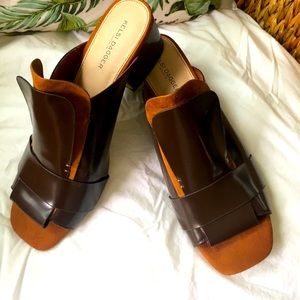 Kelsi Dagger slip on peep toe mules.